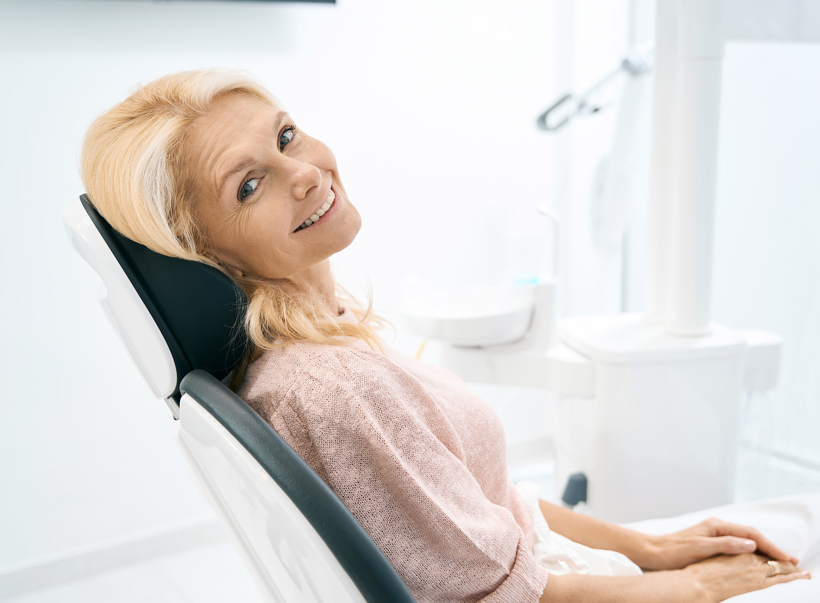 Dental implant maintenance visit including cleaning, X-rays, and gum evaluation